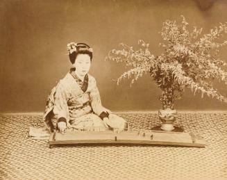 [Woman playing koto]