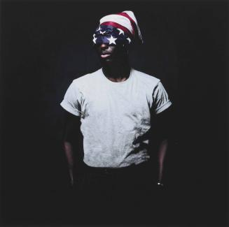 [Portrait of a Black man with American flag partially covering his face]