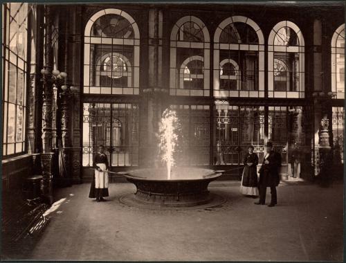 [Three people surrounding fire pit]