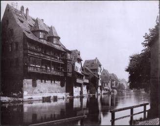[Buildings along water]