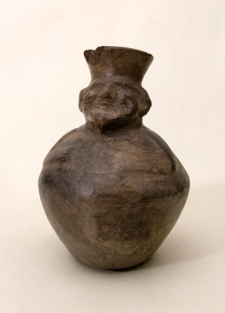 [Vessel with figure]
