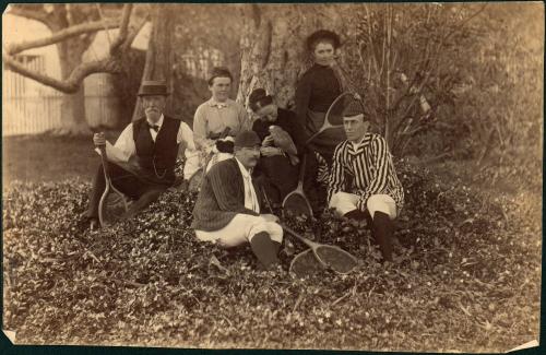 untitled [three men, two women and a boy holding tennis rackets]