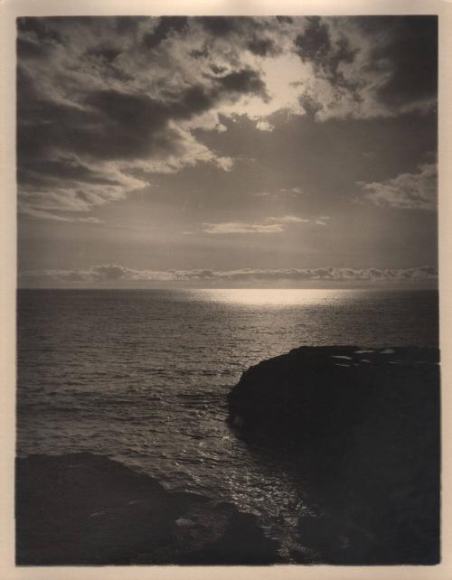 untitled [rocky coast, ocean horizon, cloudy sky with sun]