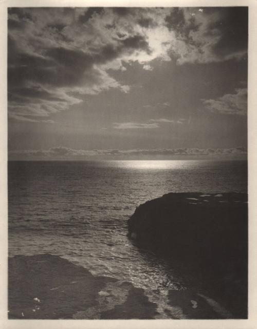 untitled [rocky coast, ocean horizon, cloudy sky with sun]