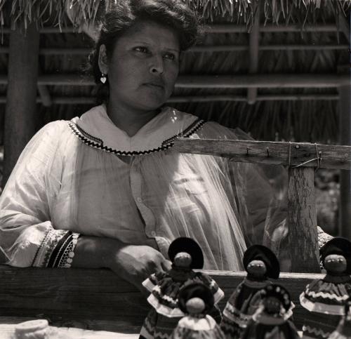 Seminole Girl Selling Dolls at Village Outside Ft. Lauderdale, Florida