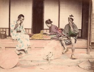 Three People, one handling food