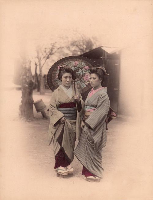 Two women with umbrella