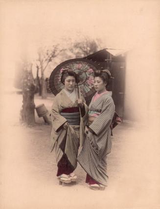 Two women with umbrella