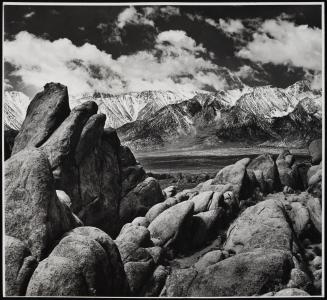 Mountainous landscape with boulders in the foreground 