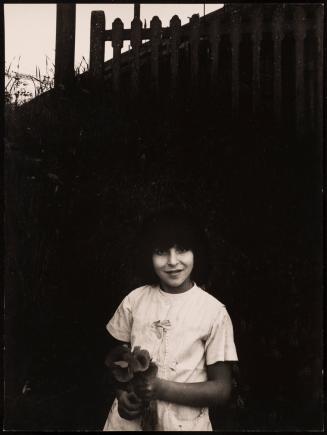 Woman with flower in hand, Italy