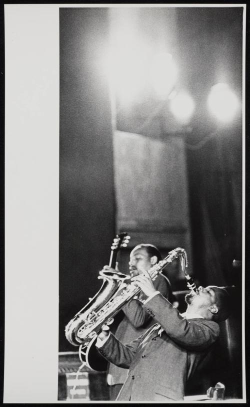 Two musicians playing saxophone and guitar, Italy