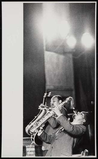 Two musicians playing saxophone and guitar, Italy