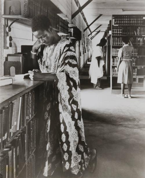 A Nigerian studies one of the 150,000 books in the stacks of the University College library in Ibadan, the largest collection in Tropical Africa