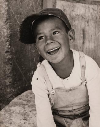 Portrait of smiling boy wearing baseball cap, Peru