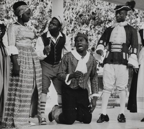 Actors on an outdoor stage performing Moliere's play "Le Bourgeois Gentilhomme," Ivory Coast, Africa