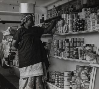Woman in supermarket (likely Kenya)