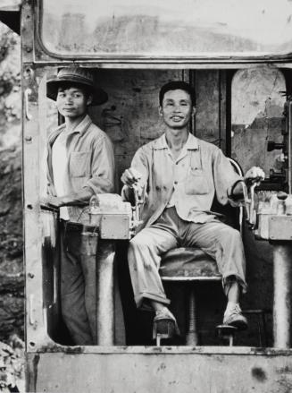 Excavation worker Chan Van Shing and and his assistant Fung Dyk Nguyen, Vietnam