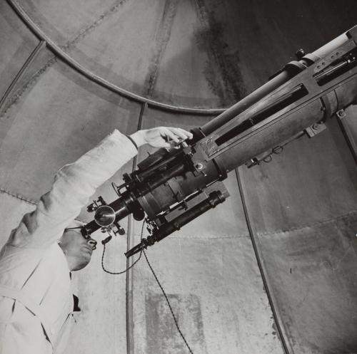 Untitled [Scientist in observatory with telescope], France