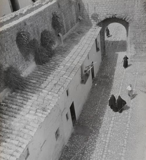 Untitled [Villagers on cobblestone street] Ibiza, Balearic Islands, Spain