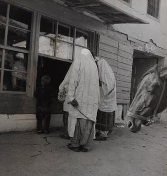 Women in front of a store, Tirana, Albania