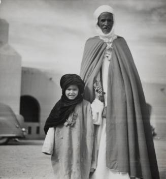The Kaid of Reggane with his grandson, Trans-Saharian Hightway, Reggane, Sahara Desert, Algeria
