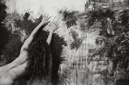 Kate, nude, place her palms against an abstractly painted wall, USA
