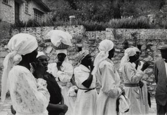 A favorite pastime of Haitian women is exchanging newsy tidbits of local gossip after Sunday Mass or on the way to market, Haiti