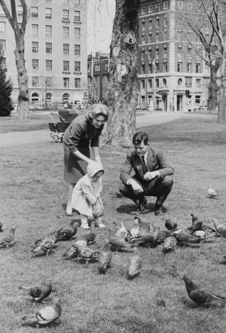 Ted and Joan Kennedy feeding pigeons with daughter Kara, Boston