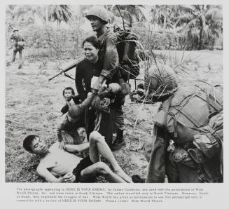 Two soldiers with a crying husband, wife and children. 