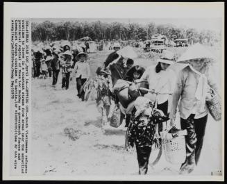 South Vietnamese refugees continue to leave in a constant stream from areas near the embattled provincial capital of Xuan Loc on Sunday, April 14th, 1975 as government forces and Communist troops continue to battle