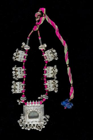 [Necklace with seven pendants]