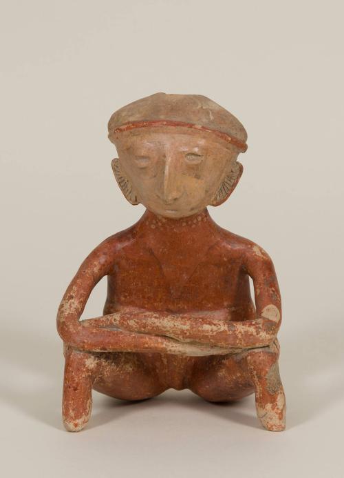 [Seated male figure]