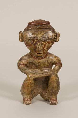 [Seated male figure]