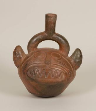 [Stirrup pot with feline head]