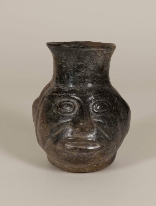 [Jar with human head]