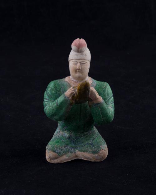 [Figure with horn]