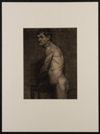 Nude Male with hands resting on table