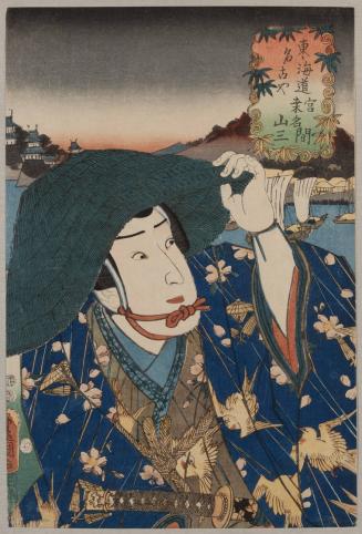 Figure wearing a green hat & blue garment