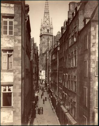 untitled [street scene, cathedral steeple visible in background]