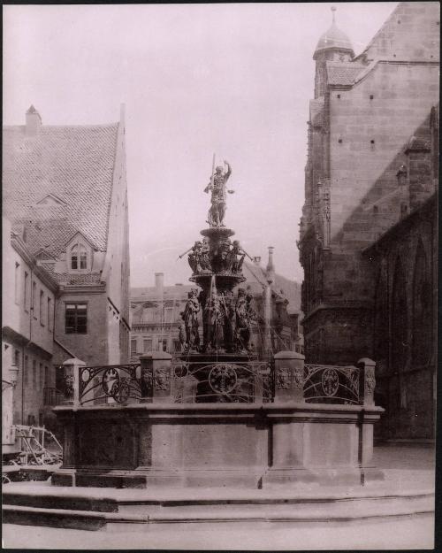 untitled [fountain between two buildings, cathedral at right]