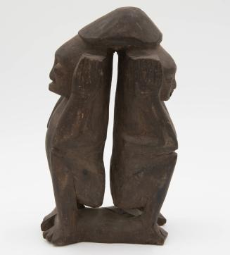 [Two squatting figures]