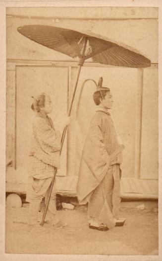Priest and retainer with umbrella