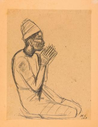 Kneeling Balinese man with hands clasped