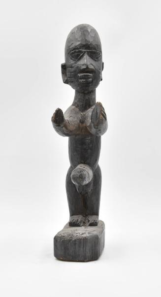 [Standing  male figure]