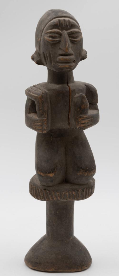 [Kneeling male figure - Ogun, God of Iron]
