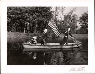3 Boys in a Boat with American Flag