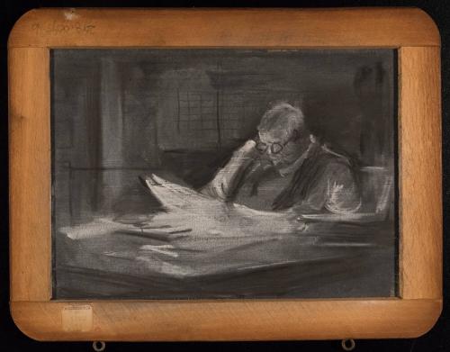 untitled [man at desk reading the paper]