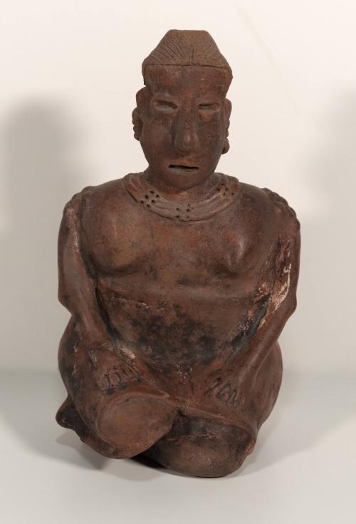 [Seated female figure]