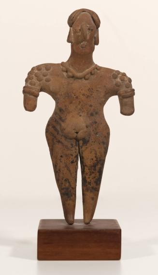 [Decorated standing figure]