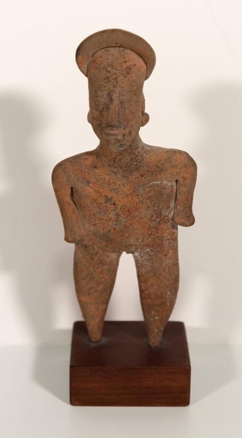 [Standing figure with headdress]